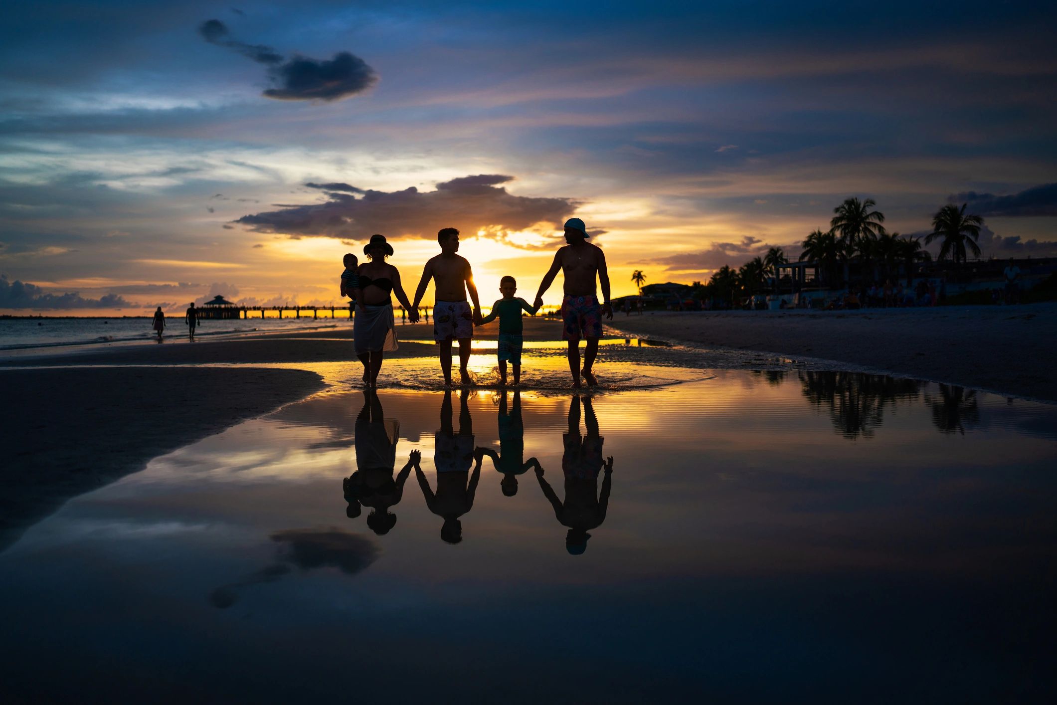 family enjoying beach vacation Florida